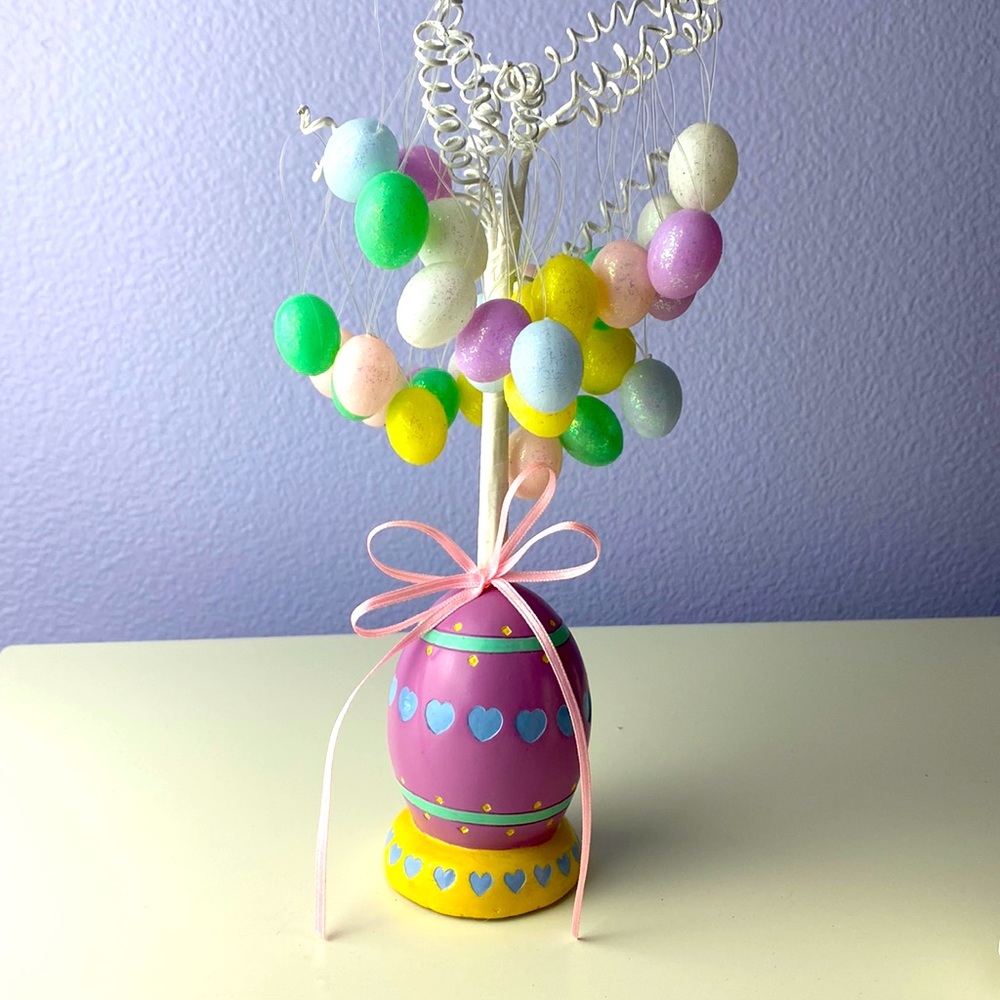 Easter egg tree with dozens of pastel Easter egg ornaments